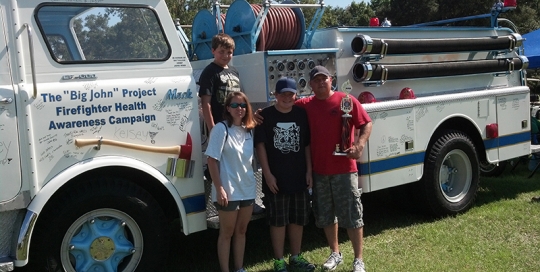 Chief John Winn's son and family with 'Big John' tribute truck.