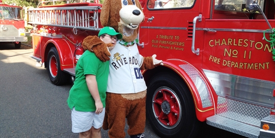 A young friend and firetruck fan with Down's Syndrome was invited to be the St. Patrick's Day Parade 'Grand Marshal of Engine 11' and he loved every minute of it!
